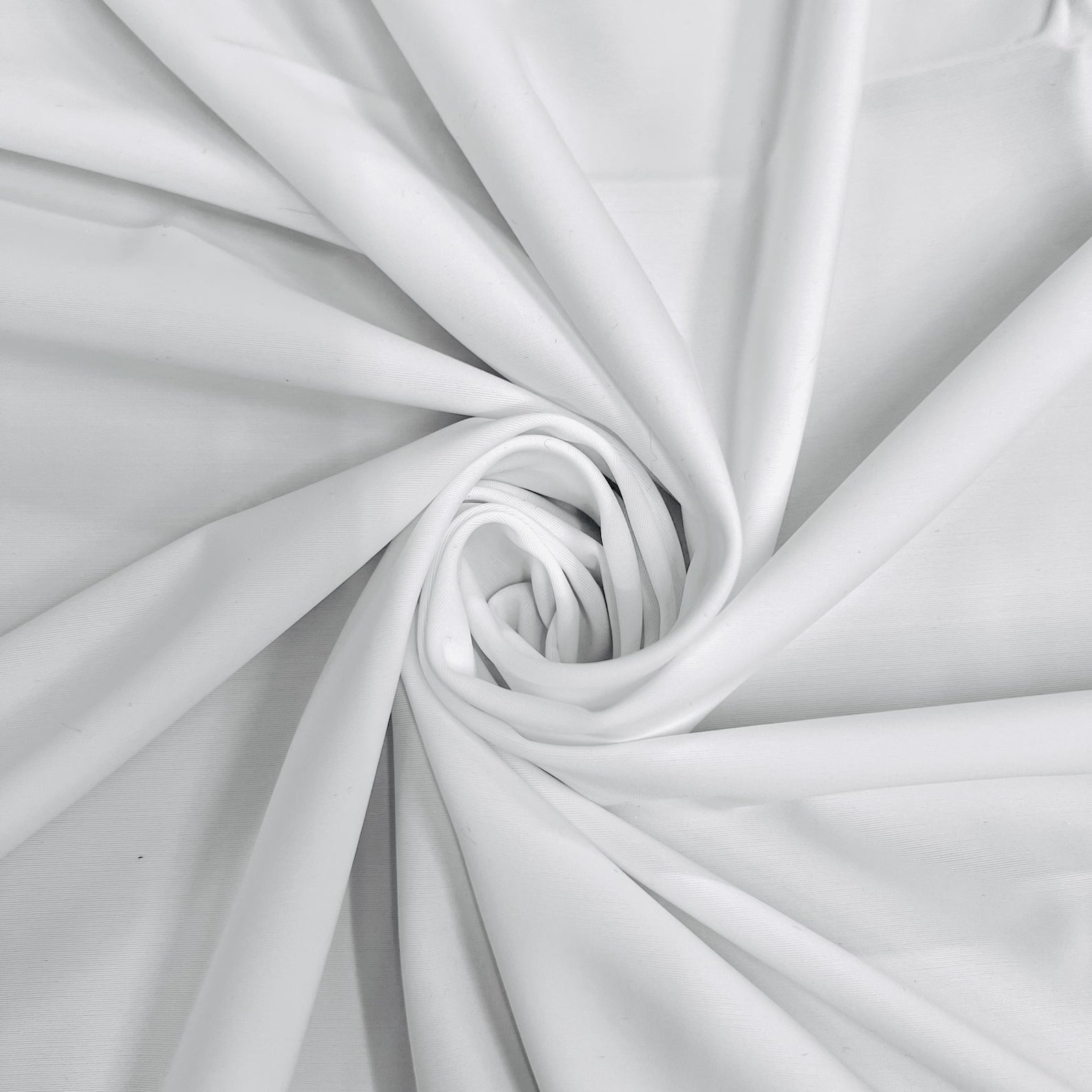 Close-up of luxury white swimwear fabric